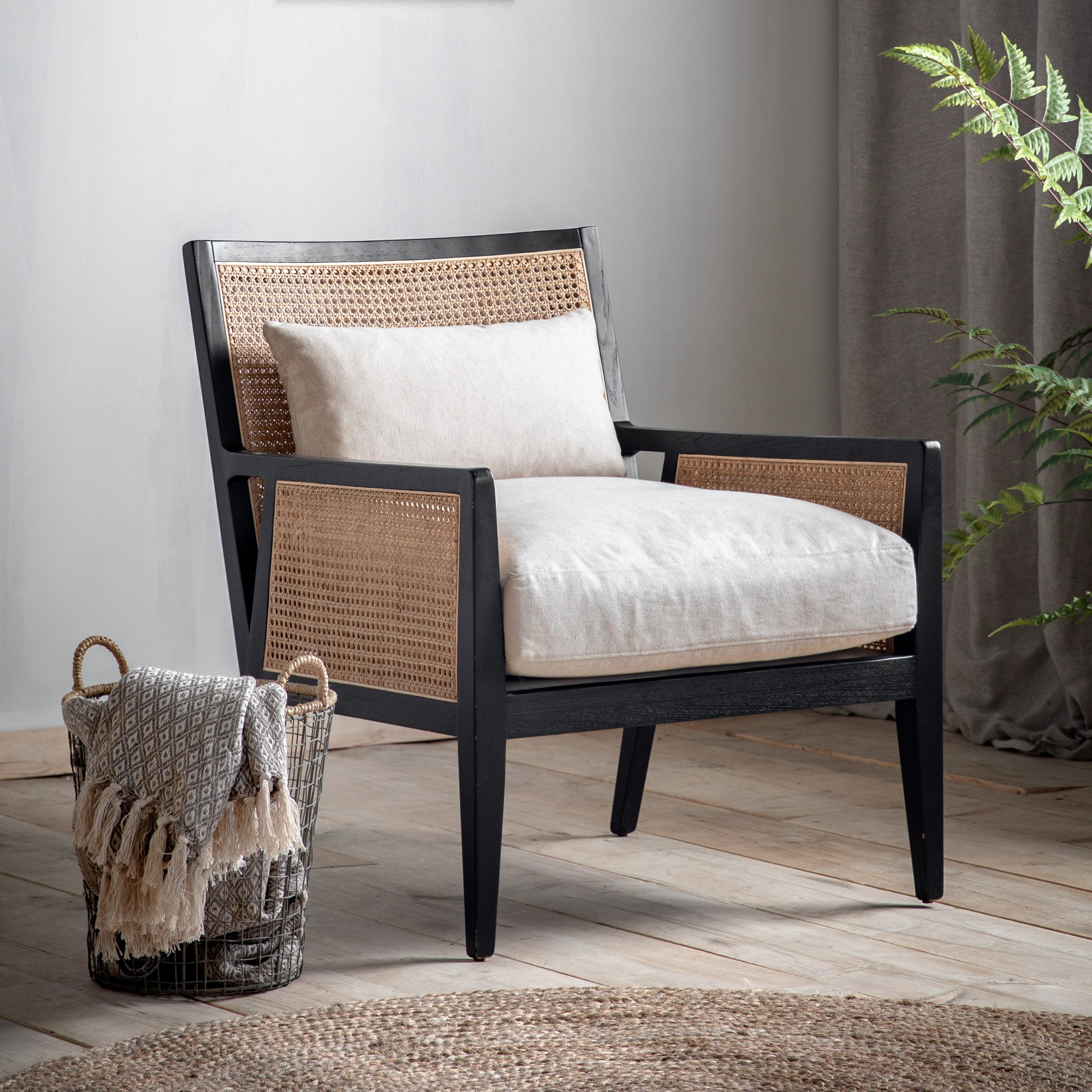 Osaka armchair in black solid wood frame with rattan detail | malletandplane.com