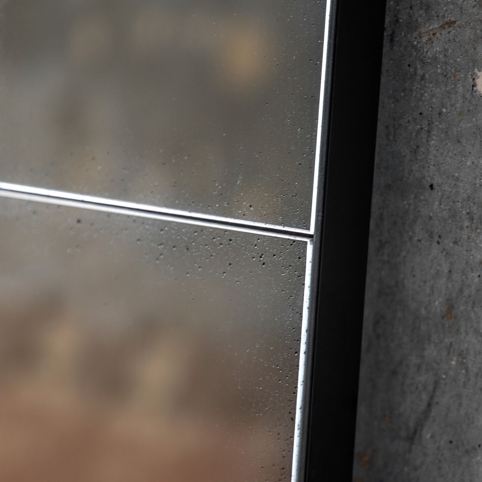 Baxter large antiqued wall mirror with 25 mirrored pieces in a structural metal outer frame | malletandplane.com