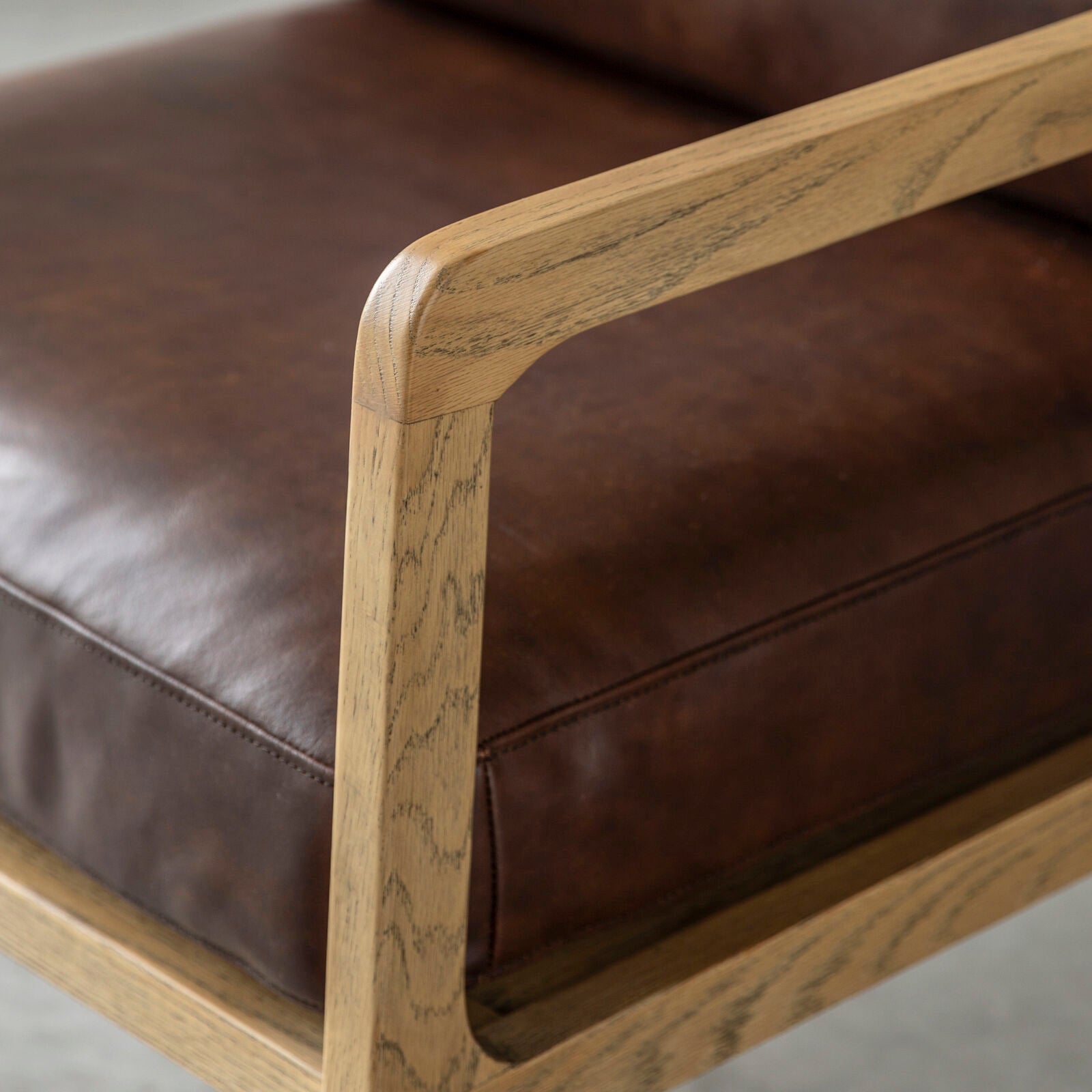 Cortona brown leather upholstered armchair with solid oak frame | malletandplane.com