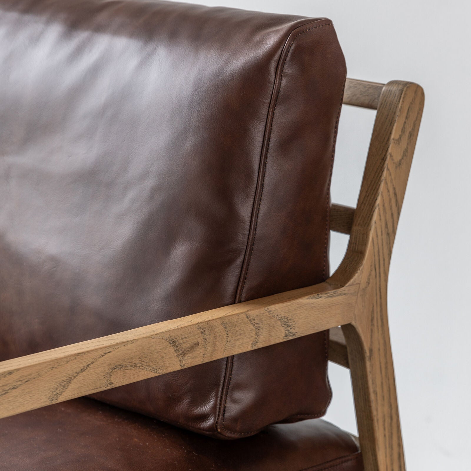 Cortona brown leather upholstered armchair with solid oak frame | malletandplane.com