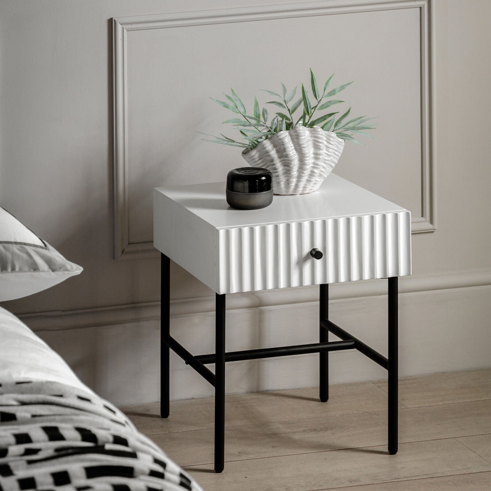 Flute bedside table with drawer in white finish with scalloped fascia and black metal underframe | malletandplane.com