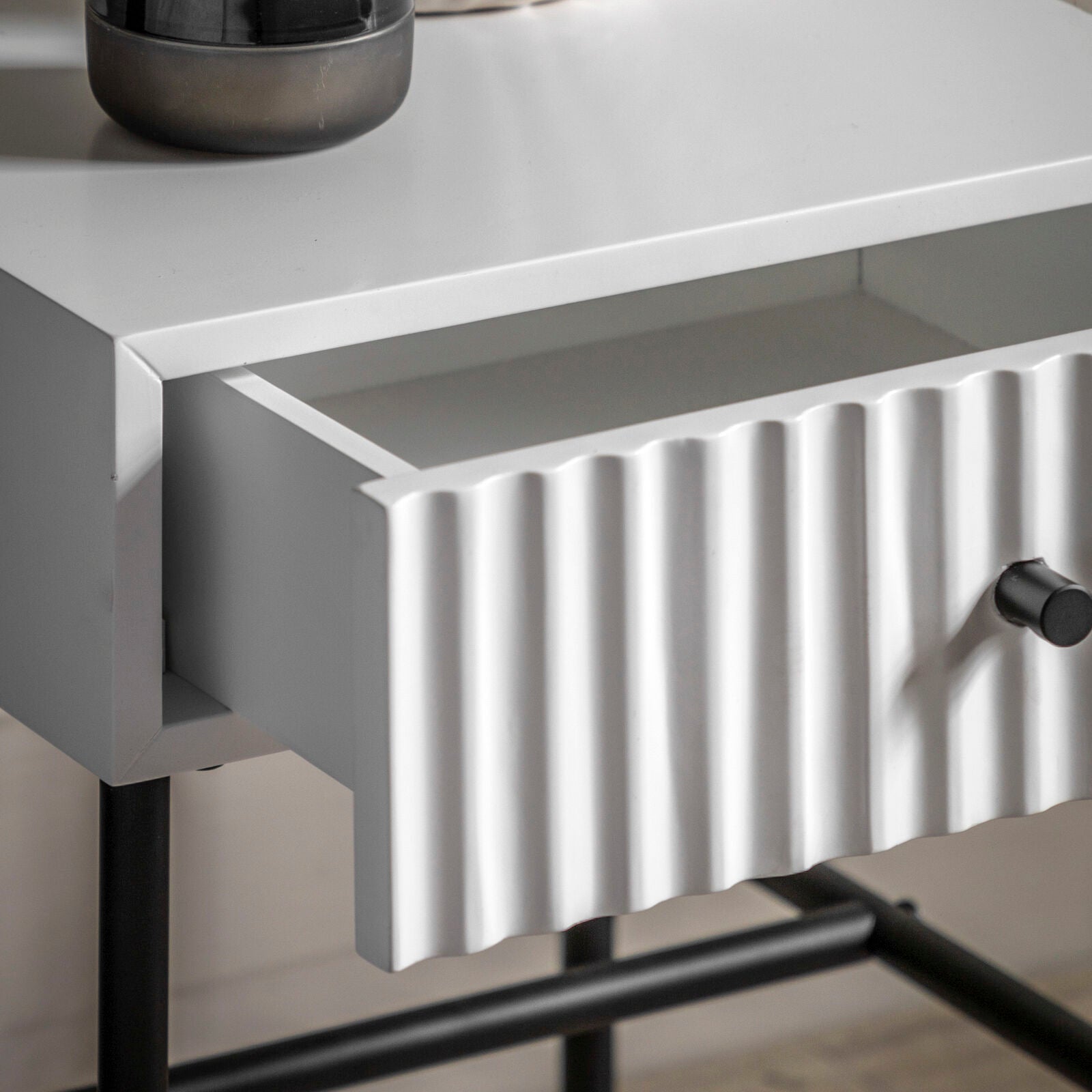 Flute bedside table with drawer in white finish with scalloped fascia and black metal underframe | malletandplane.com