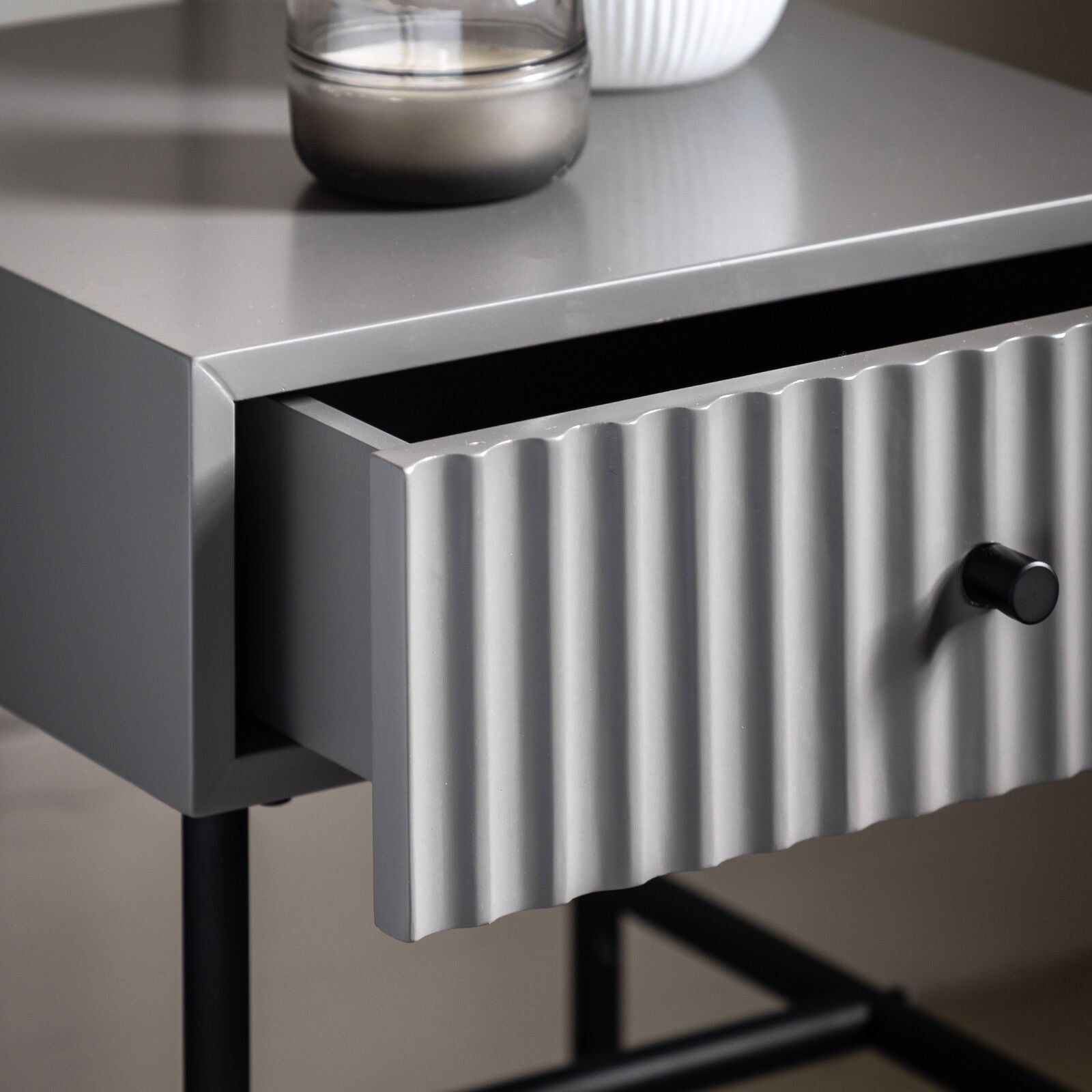 Flute bedside table with drawer in grey finish with scalloped fascia and black metal underframe | malletandplane.com