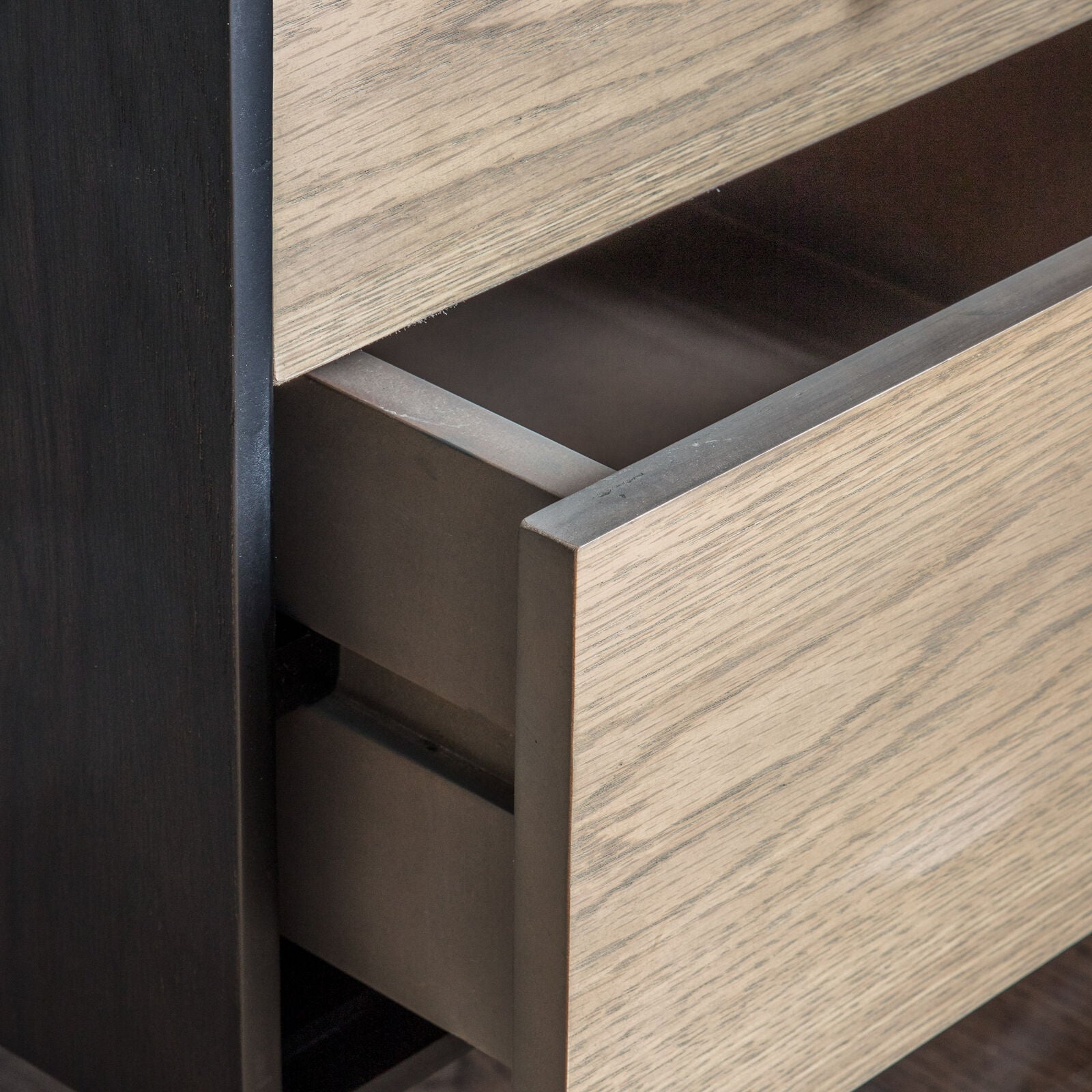 Fulham contemporary style home study desk with black oak surface and natural oak drawer fronts with a black metl frame | malletandplane.com