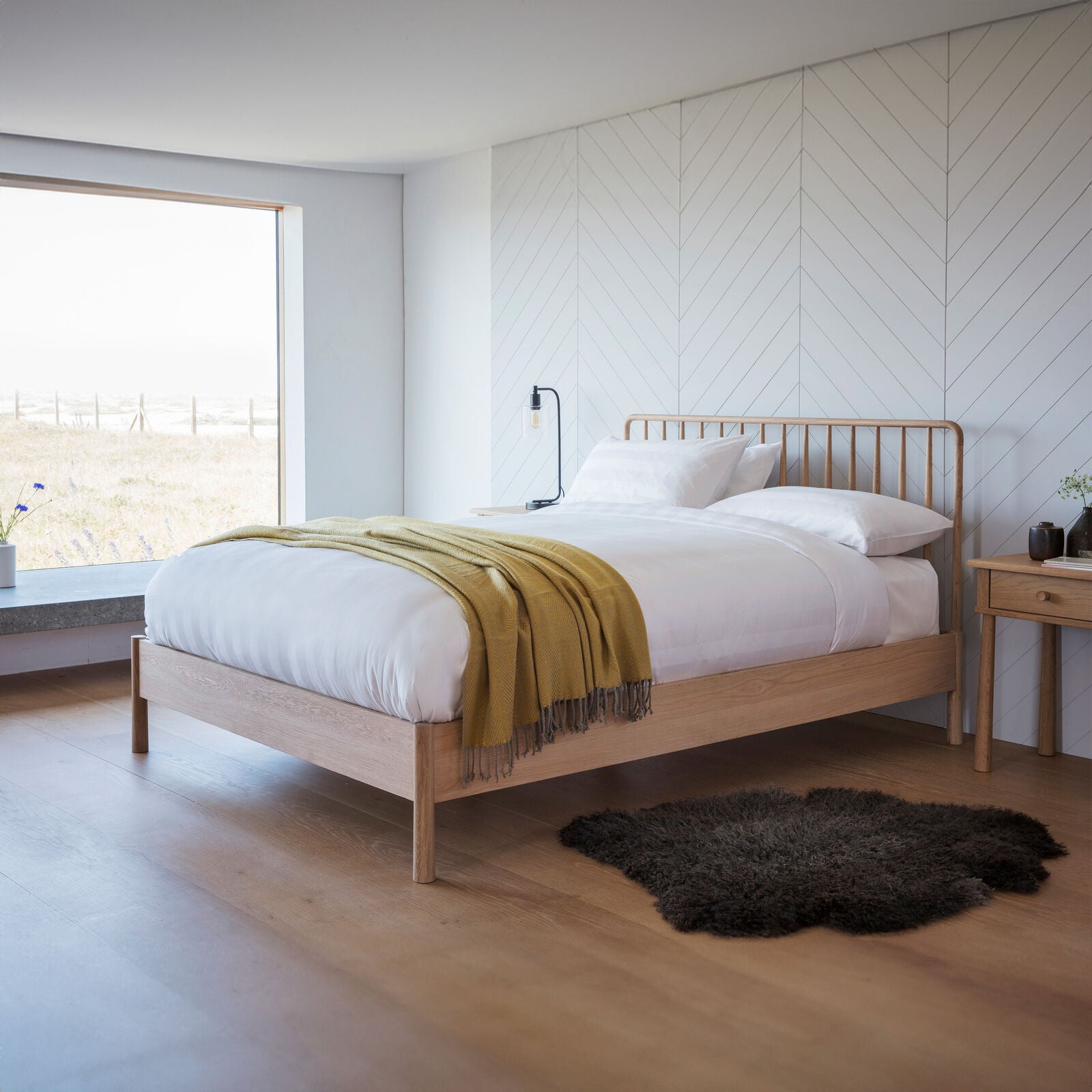 Axel natural oak double bed with spindle details in vernacular style | malletandplane.com