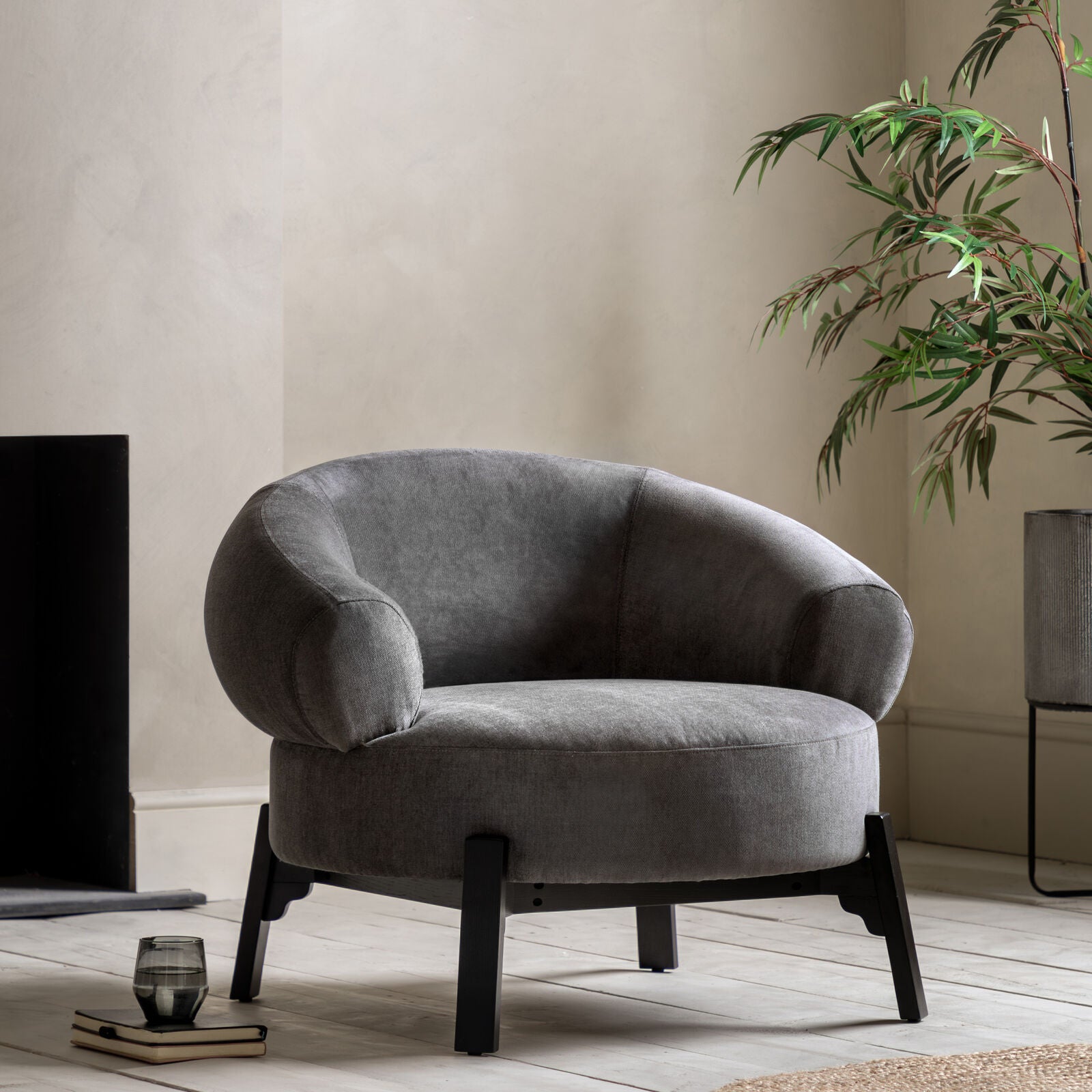 Harvey anthracite curved armchair with dark wood base frame and legs | malletandplane.com