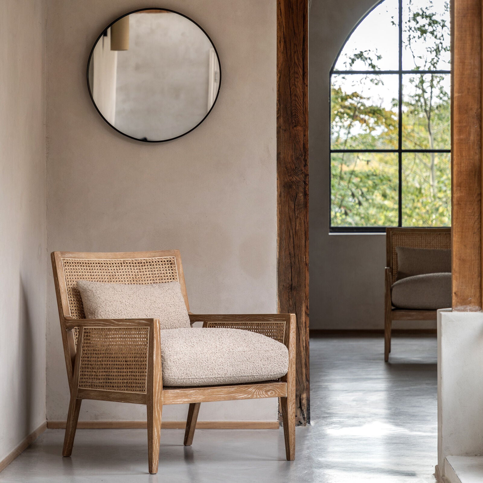 Osaka Natural Rattan Armchair with solid wood frame, woven rattan backrest and cream upholstered seat — stylish Scandinavian accent chair for living rooms and bedrooms. | malletandplane.com