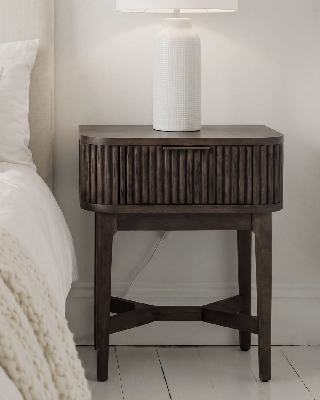 RAIE walnut finished bedside table with ribbed styling and 1 drawer