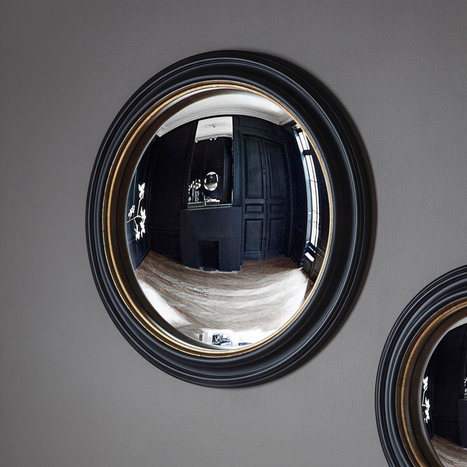 Brunel 630mm convex round wall mirror in black and gold finish | malletandplane.com