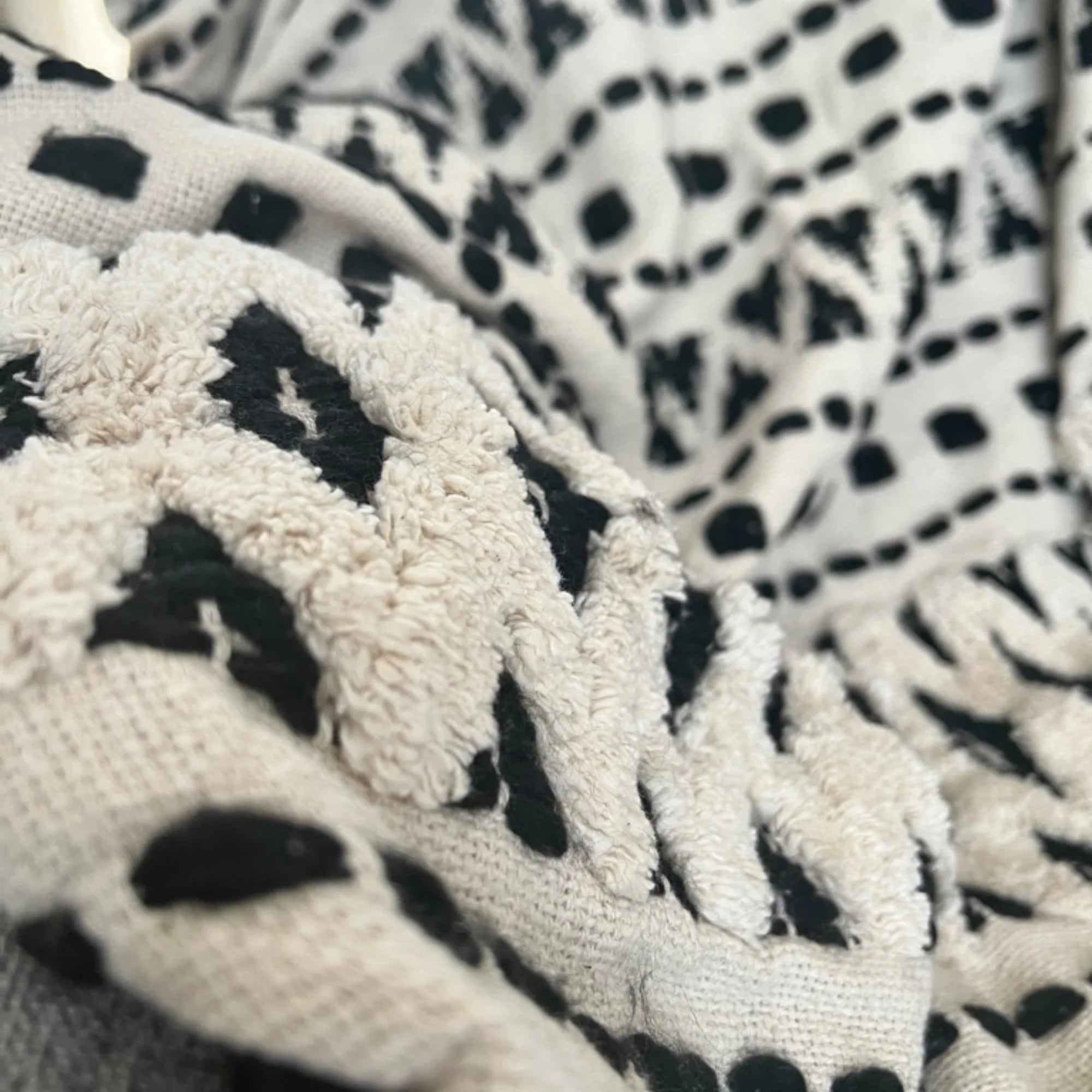 Aztec contemporary tufted cream throw with a beautiful black stitched aztec design | malletandplane.com